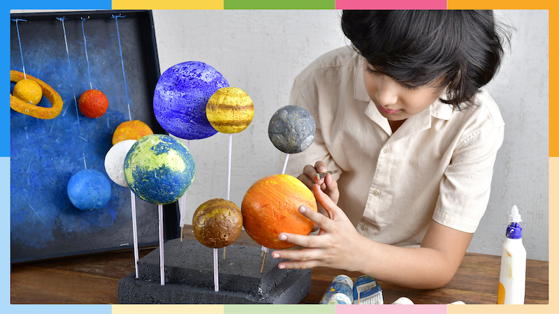 Boy presenting solar system project